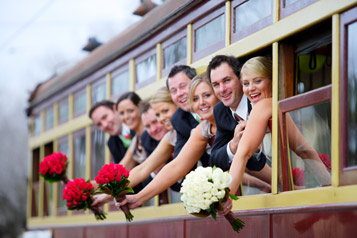 Wedding party hanging out windows of a Bendigo Tramways Tram